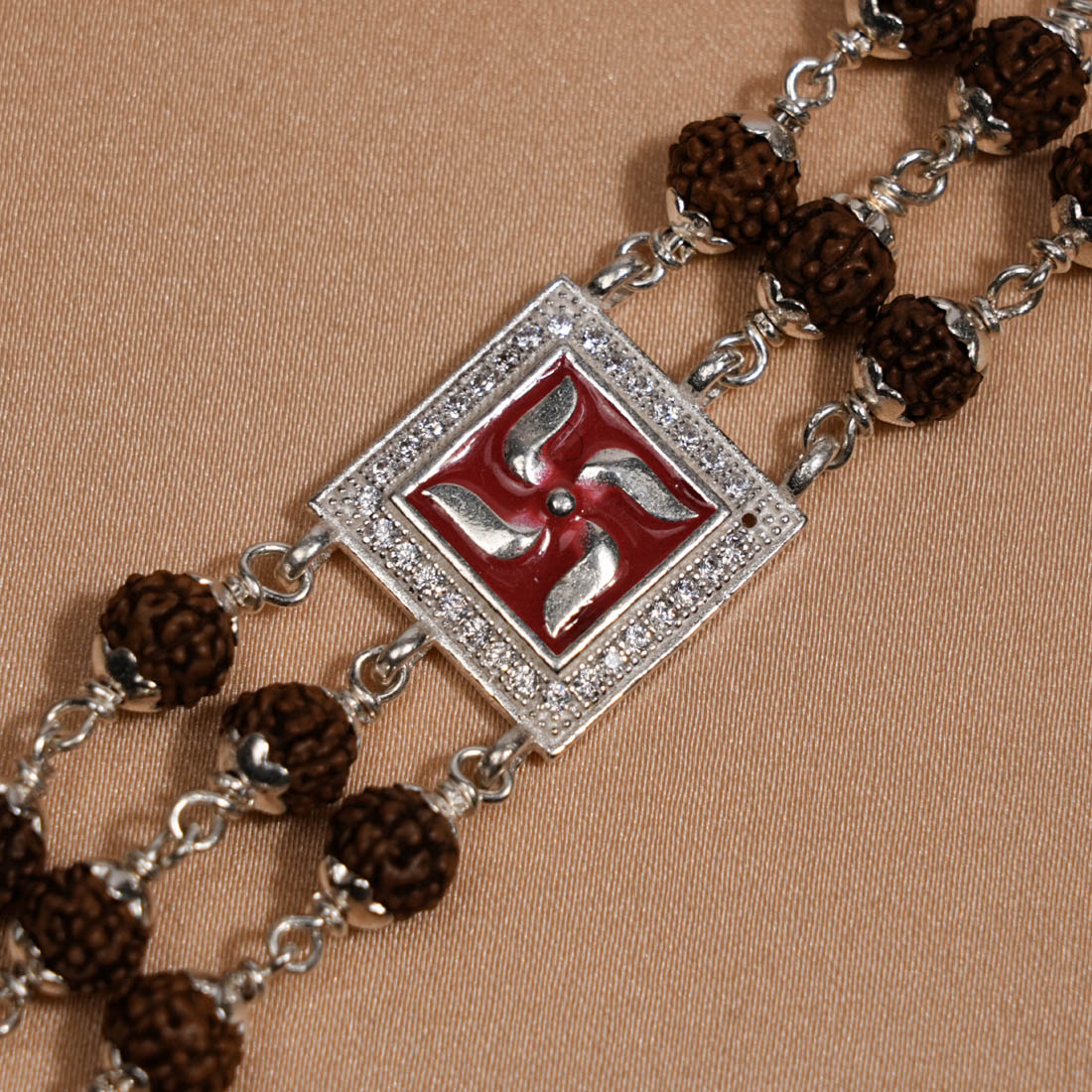 Rudraksha Silver Swastik in Red Triple Line Bracelet