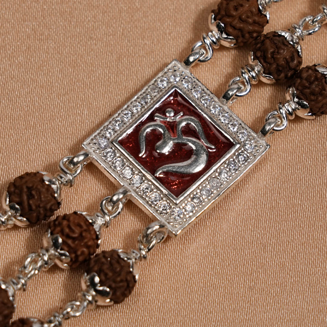 Rudraksha Silver Om in Red Triple Line Bracelet