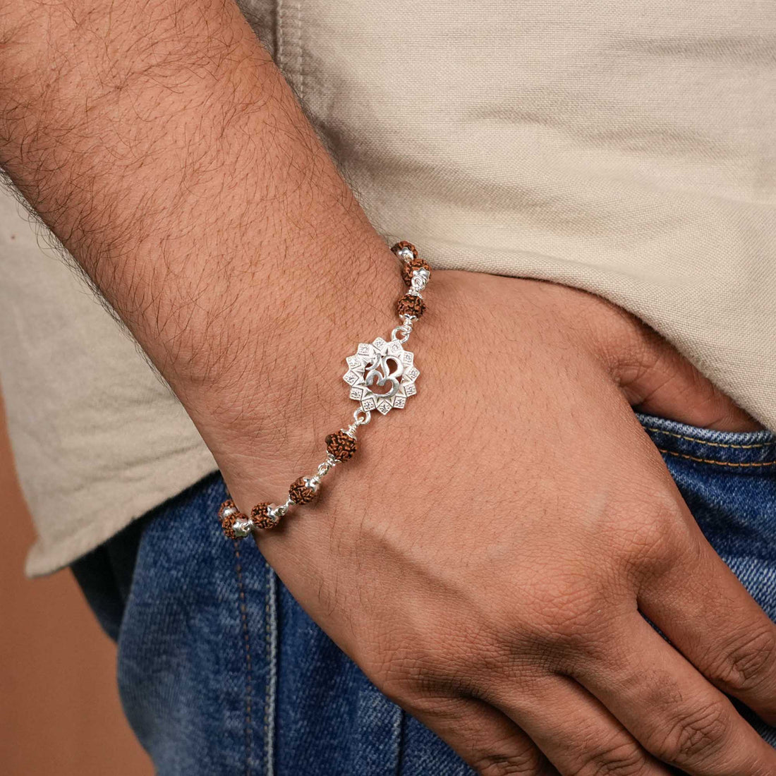 Rudraksha silver bracelet with Om in a concave sphere single line