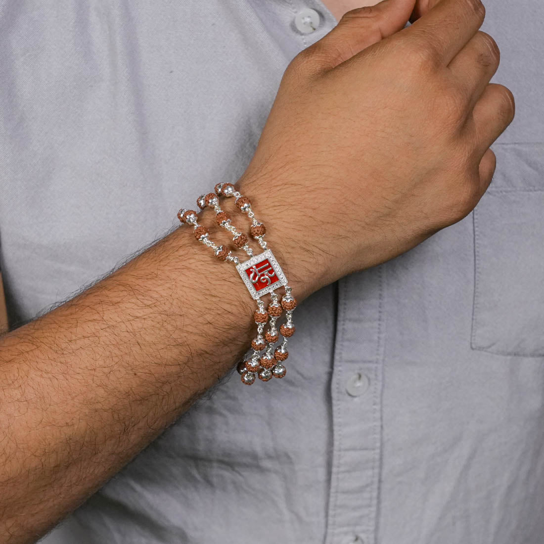 Orignal Rudraksha Silver Shree in Red Triple Line Bracelet