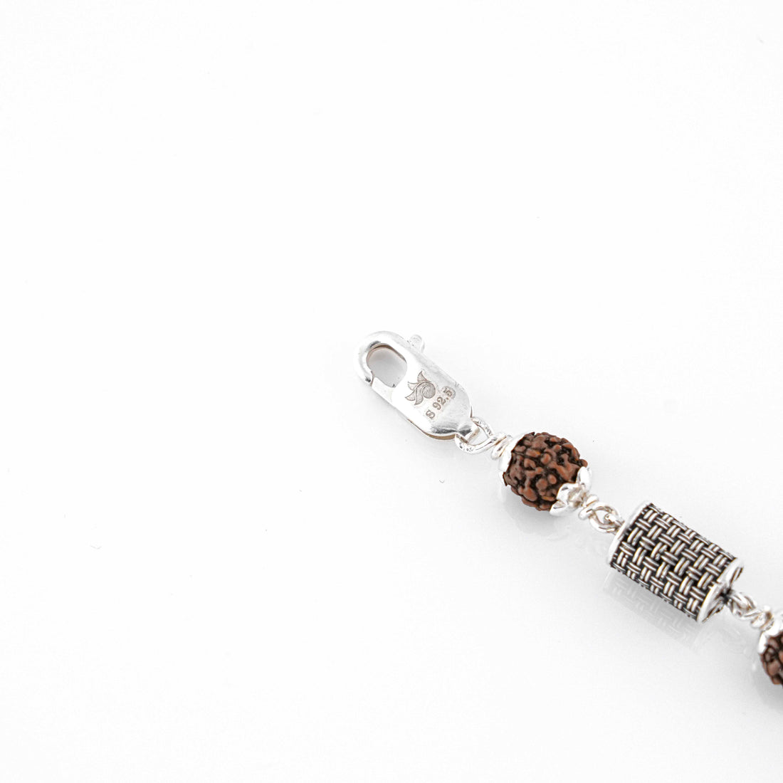 Silver Rakhi with Rudraksha and Hollow Cylindrical Beads