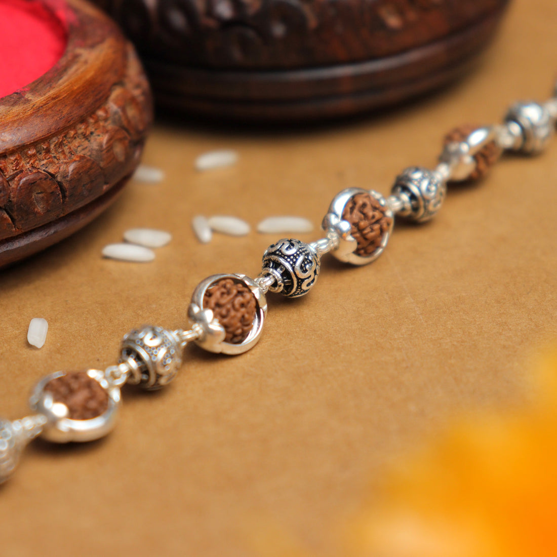 Pure Silver Rakhi with Om Beads Capping and Rudraksha Bracelet