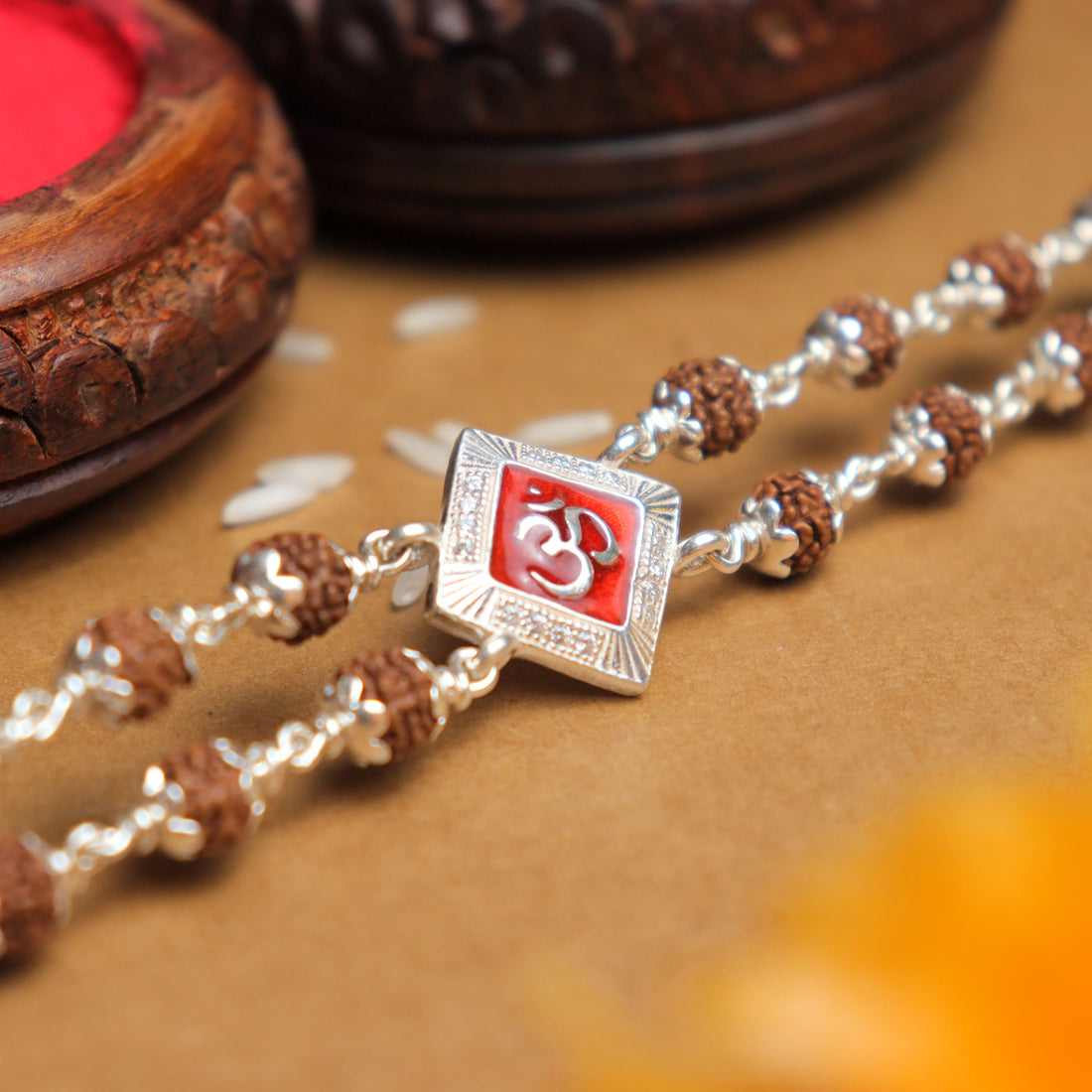 Pure Silver Rakhi with Rudraksha and Om, Red-Colored Double Line Design