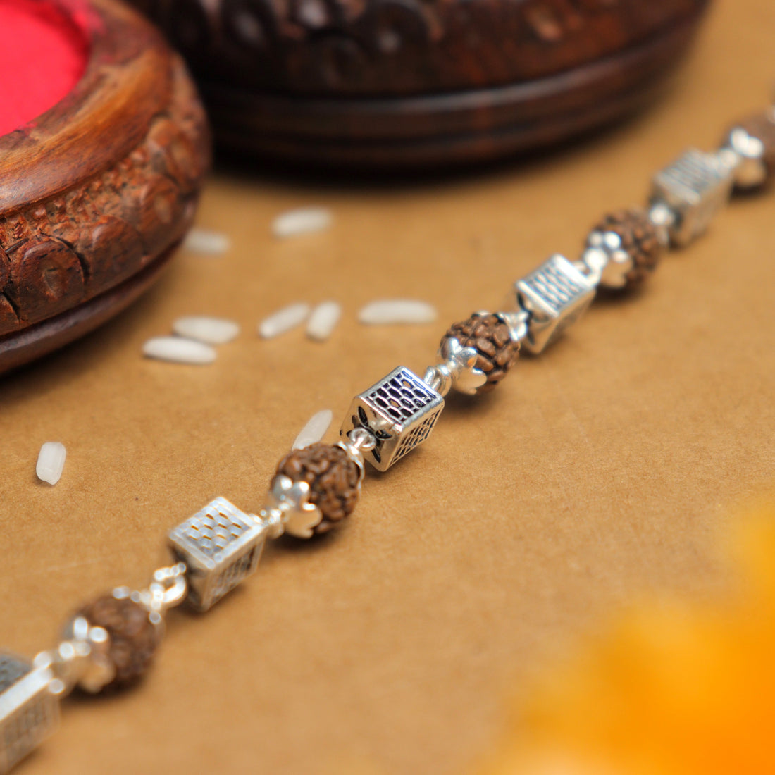 Pure Silver Rakhi with Square Cylinder Rudraksha Beads