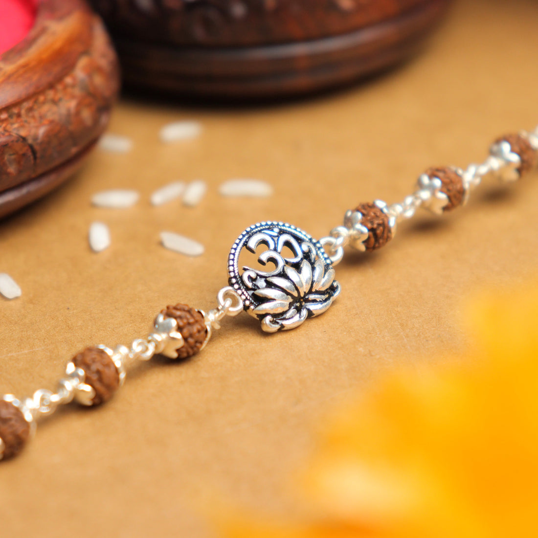 Pure Silver Rakhi with Om and Lotus Flower and Single Line Rudraksha for Men