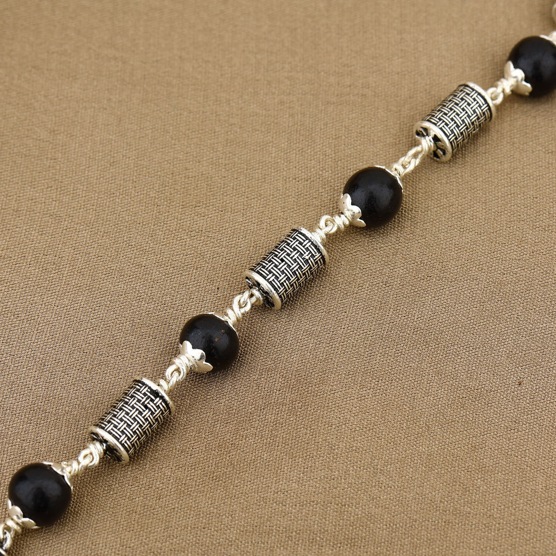 Karungali with Hollow Cylindrical Silver Bracelet