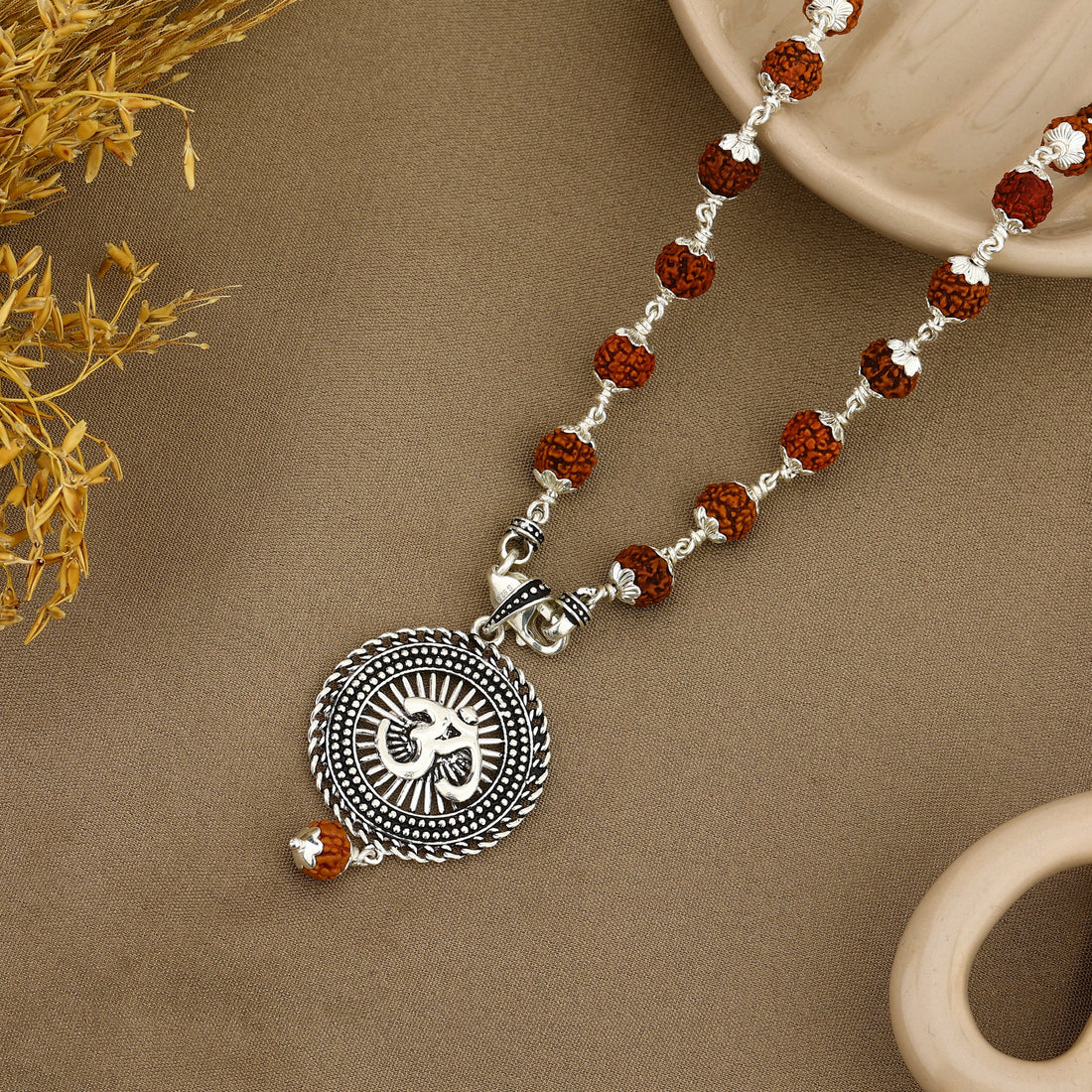 Sacred Surya Om Rudraksha Silver Pendant with Rudraksha beads