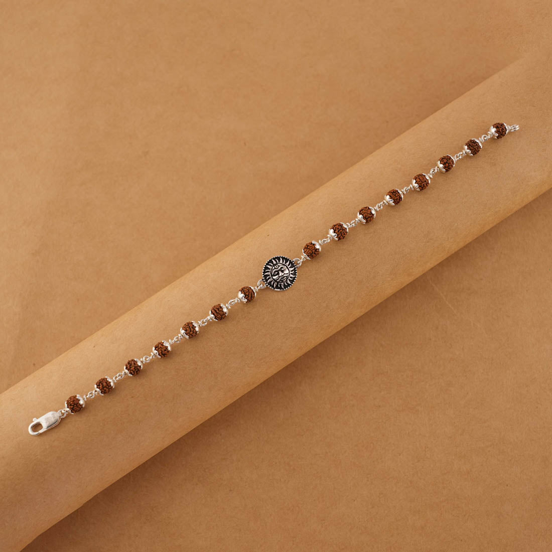 Stylish Silver Rakhi with Suryadev and Rudraksha