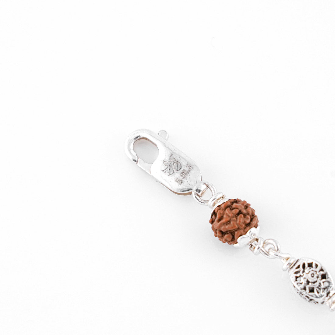 Silver Rakhi with Rudraksha and Hollow Circular Beads