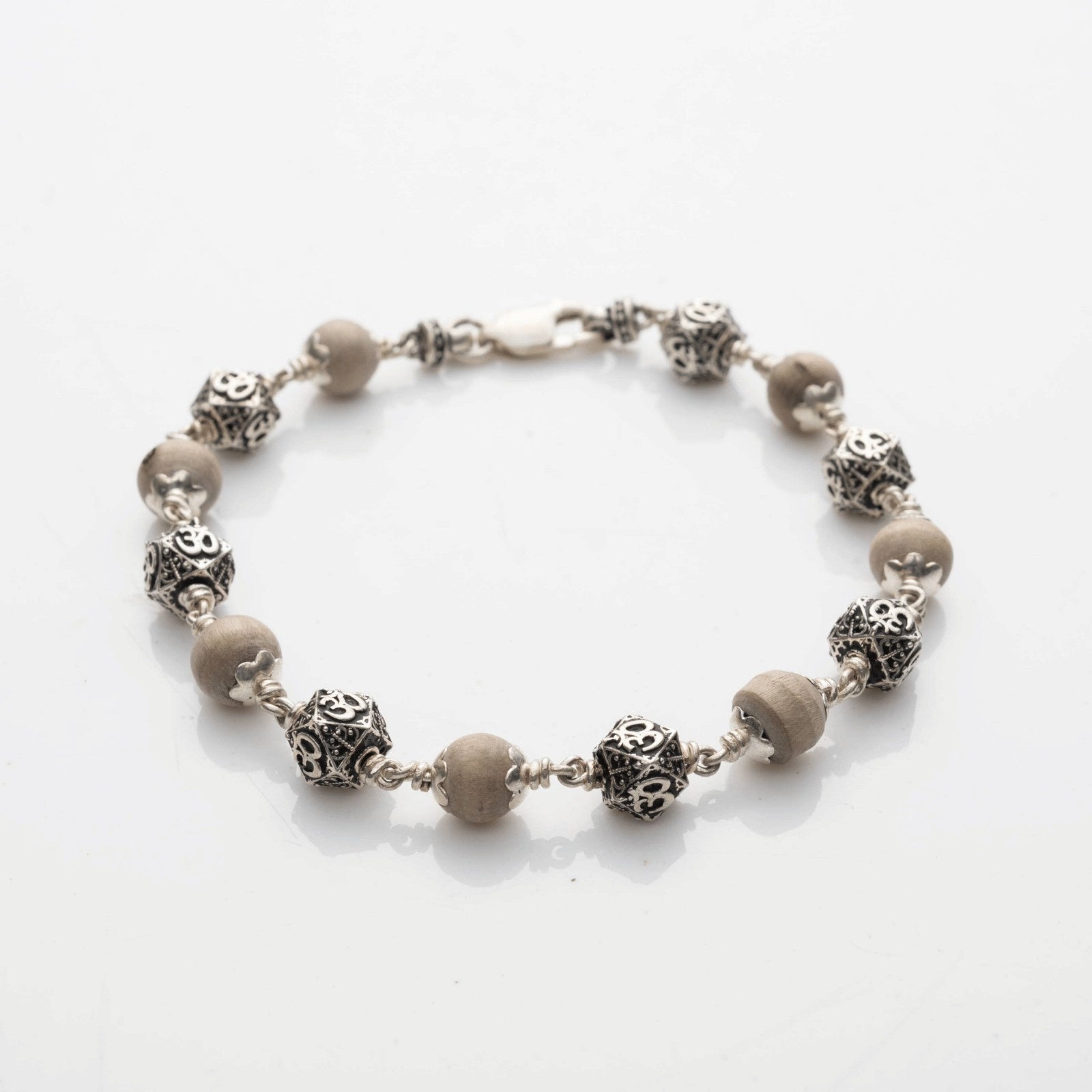 Tulsi With Silver Hexagon Om Beads Bracelet