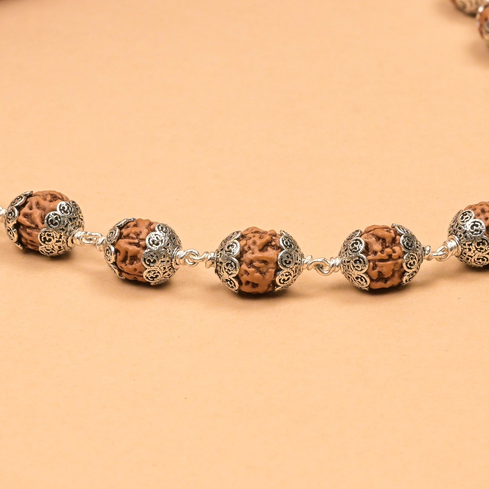 Rudraksha with Om Cap Silver Mala