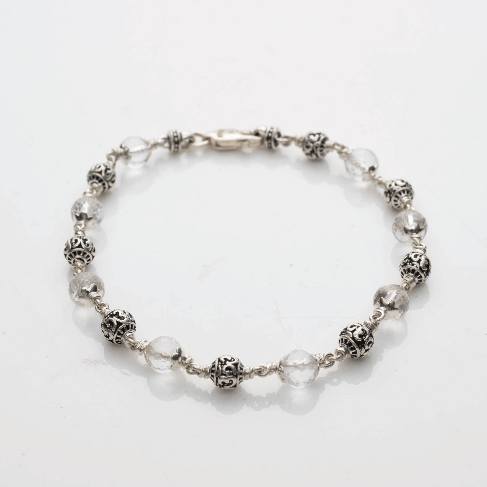 Sphatik Diamond Cut Beads With Om Silver Beads Bracelet