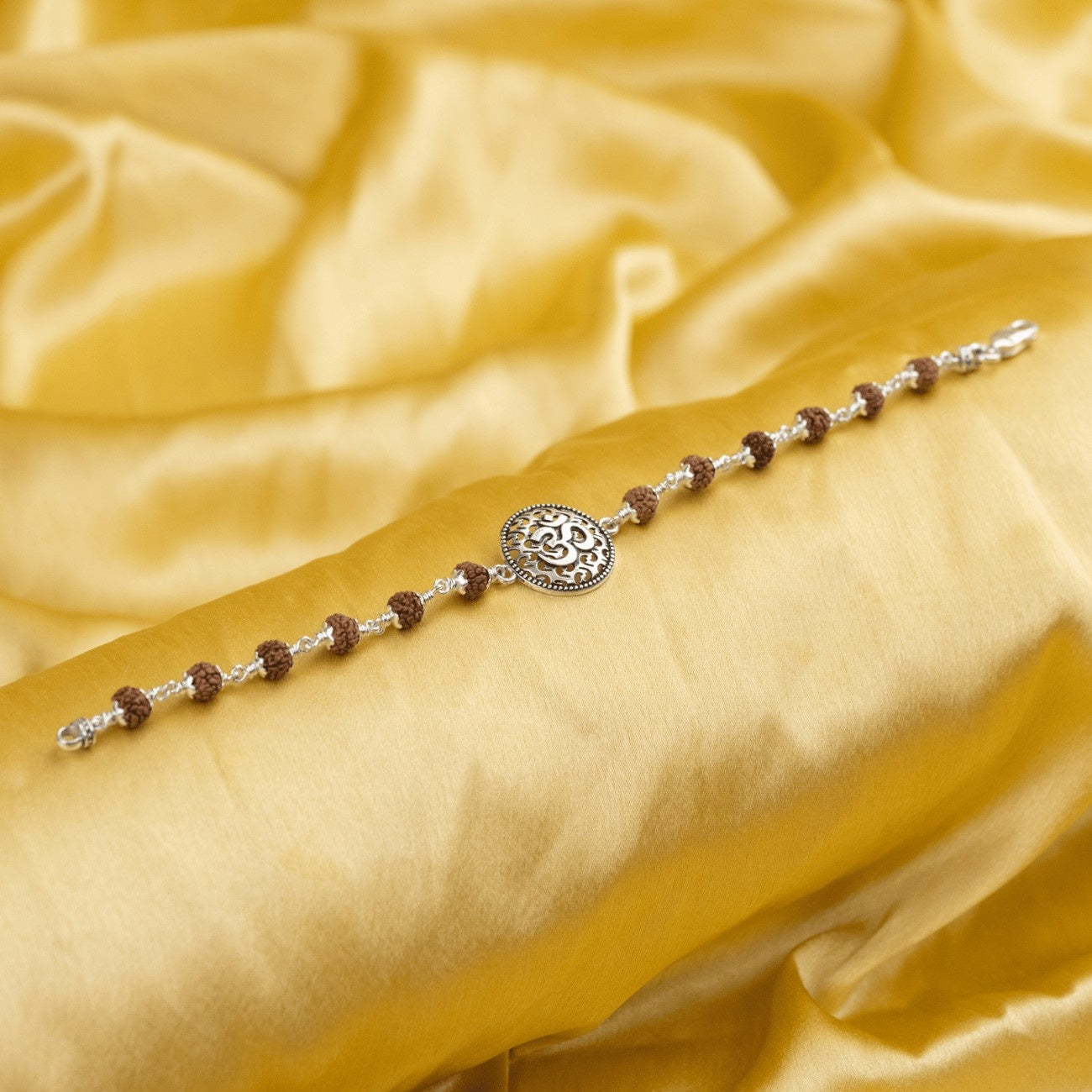 Rudraksha With Om on Round Silver Broach Bracelet