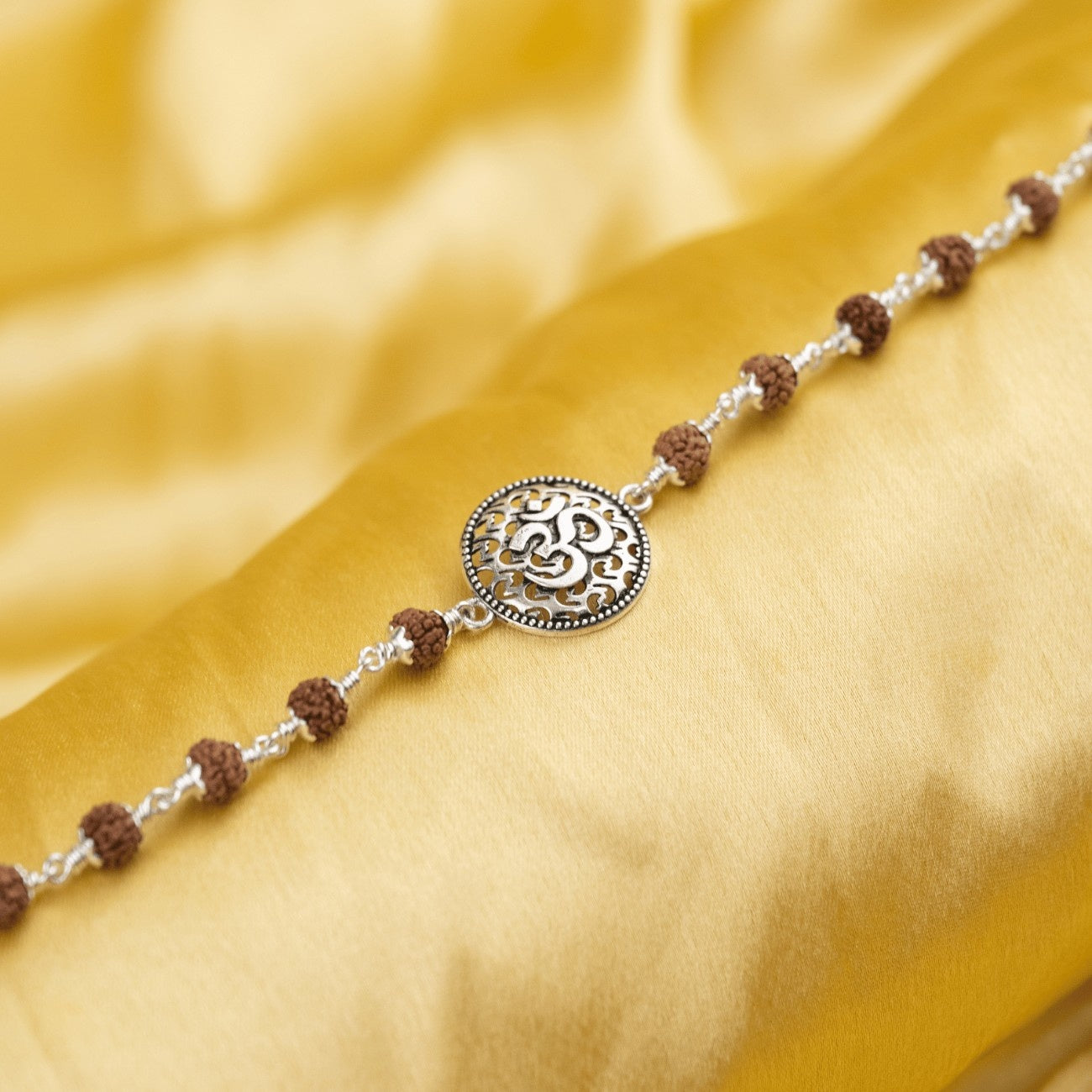 Rudraksha With Om on Round Silver Broach Bracelet