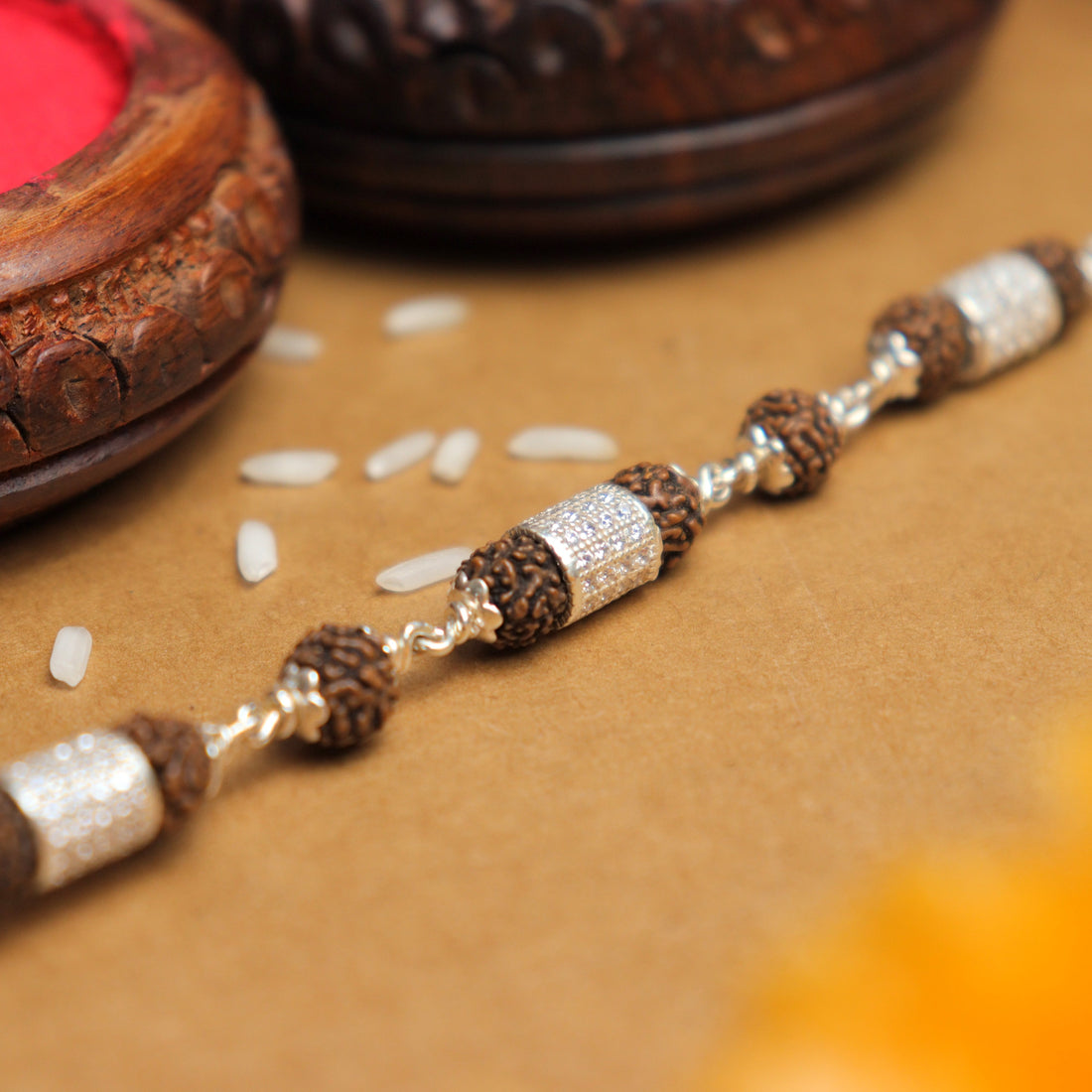Pure Silver Rakhi with Rudraksha and Three Diamond Cylinders