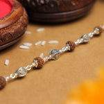 Pure Silver Rakhi with Rudraksha and Hollow Circular Beads