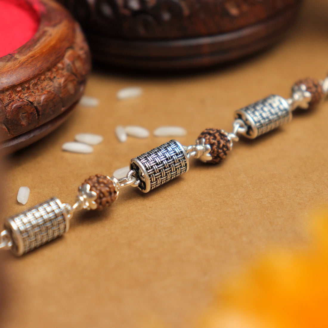 Pure Silver Rakhi with Rudraksha and Hollow Cylindrical Beads