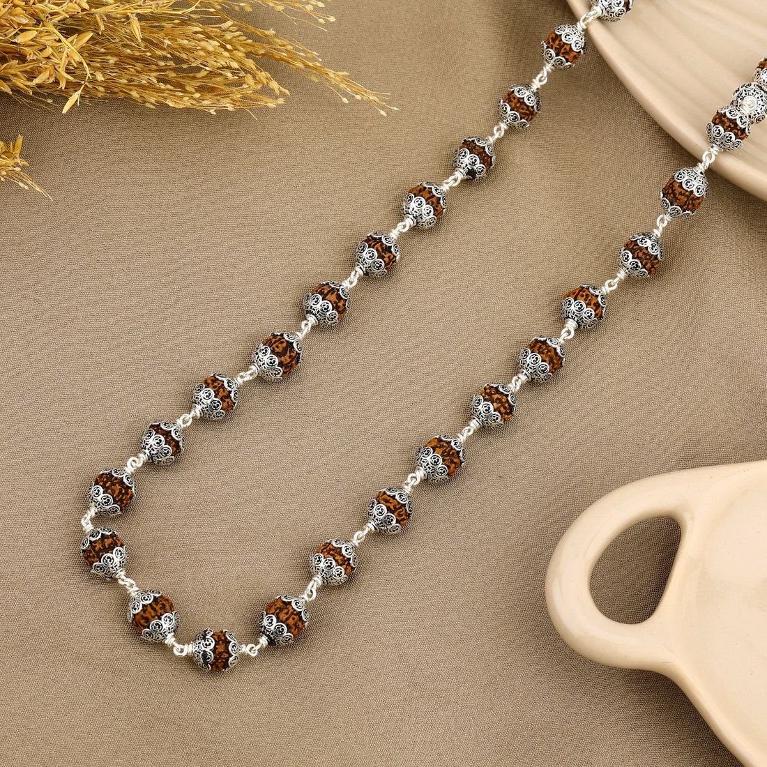 Authentic Rudraksha with Om Cap Silver Mala