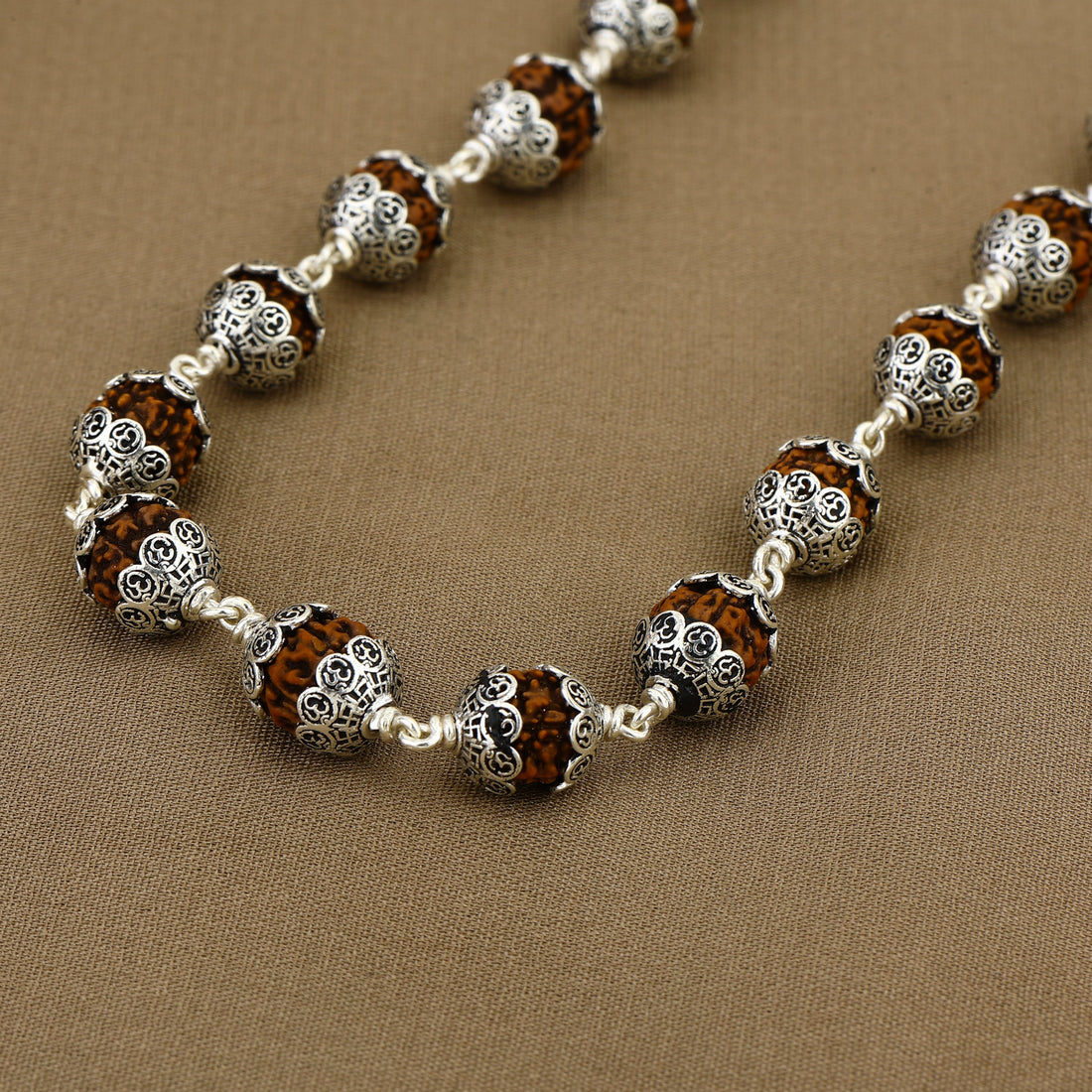 Rudraksha with Om Cap Silver Mala