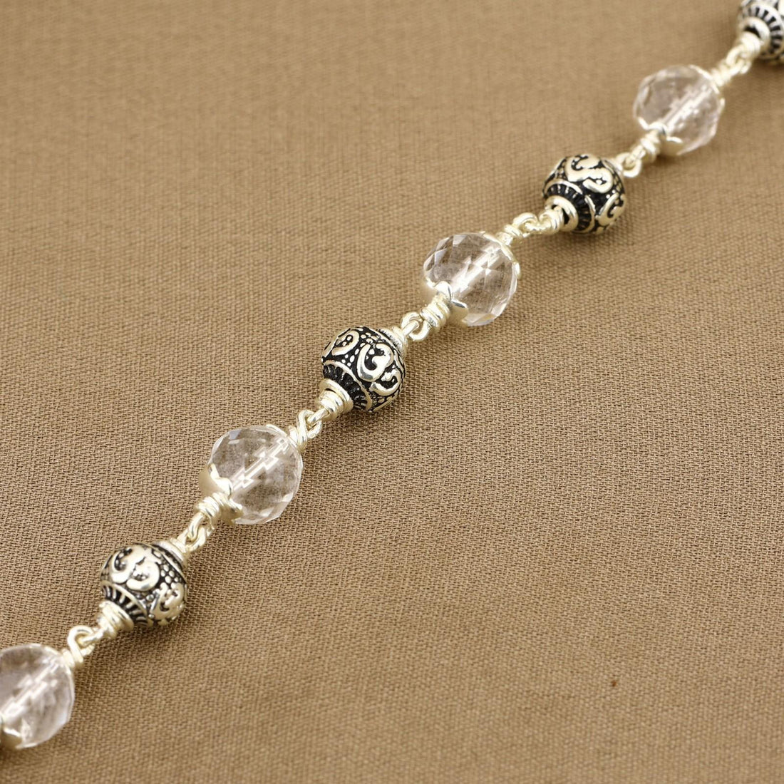 Sphatik Diamond Cut Beads With Om Silver Beads Bracelet