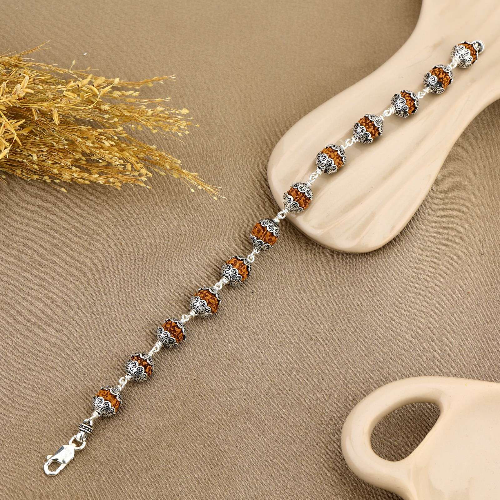 Rudraksha With Om Cap Silver Bracelet