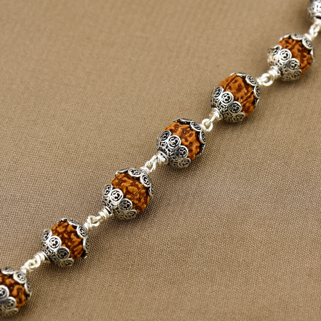 Rudraksha With Om Cap Silver Bracelet