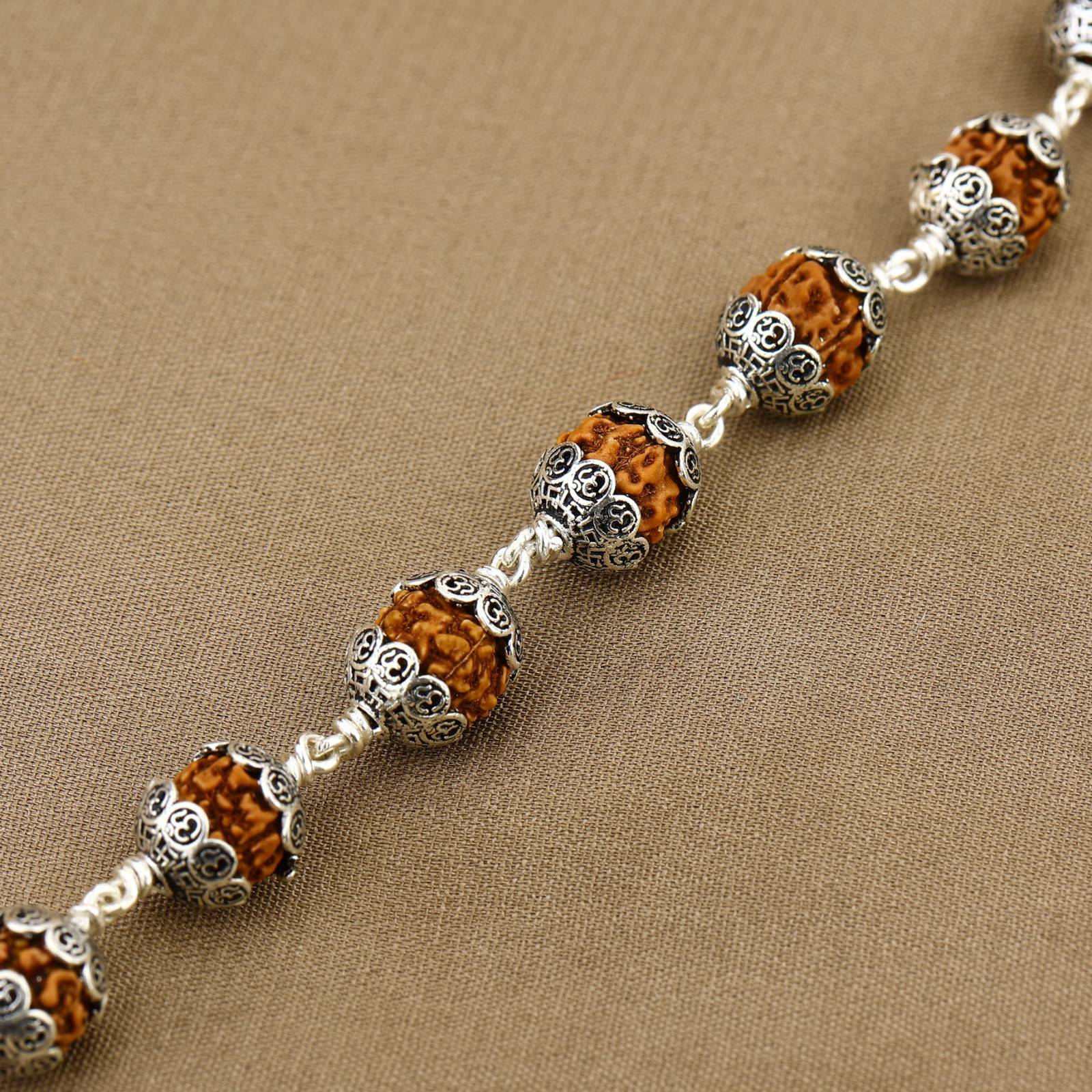 Rudraksha With Om Cap Silver Bracelet