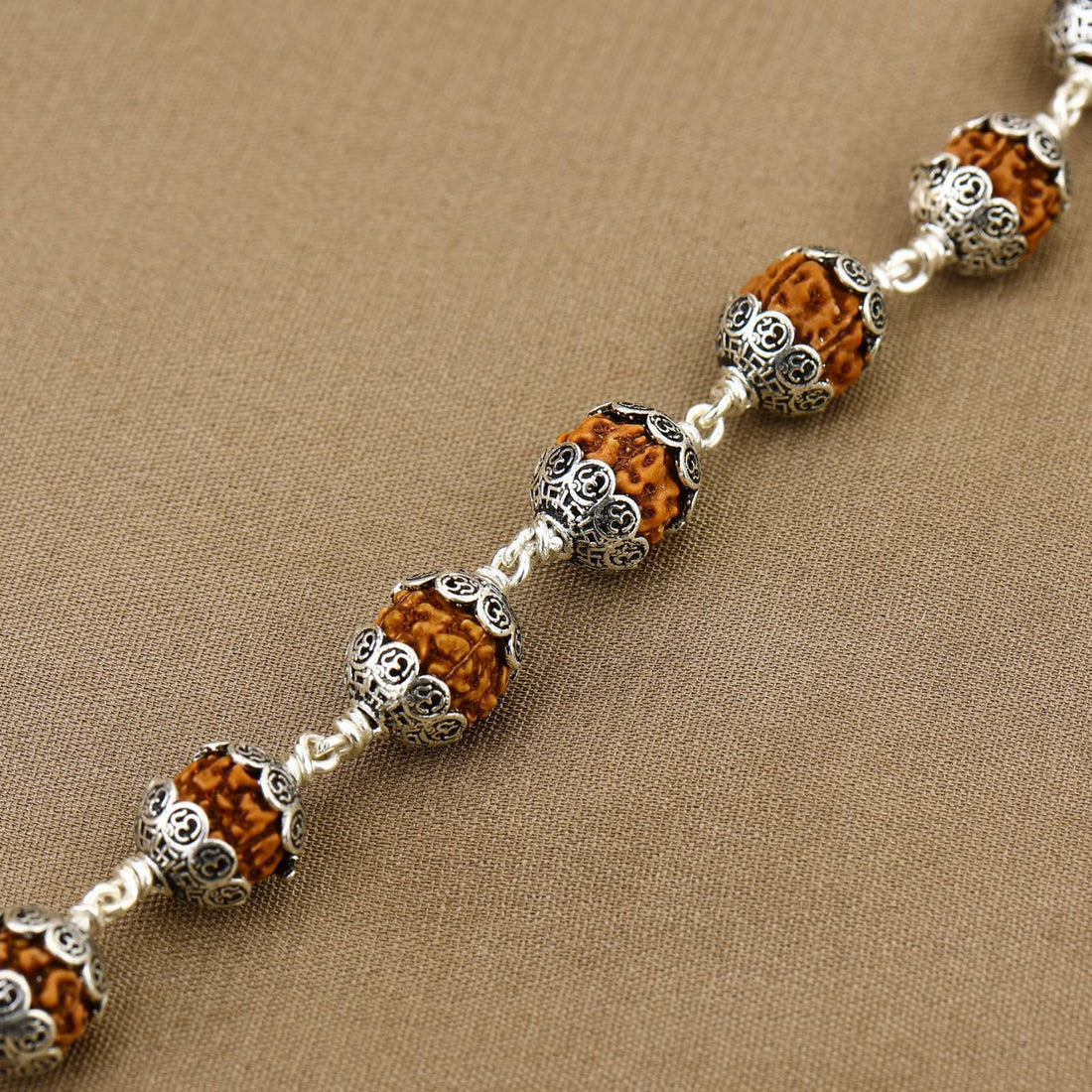 Rudraksha With Om Cap Silver Bracelet
